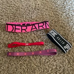 Three ladies Under Armour headbands and a Pink XS band